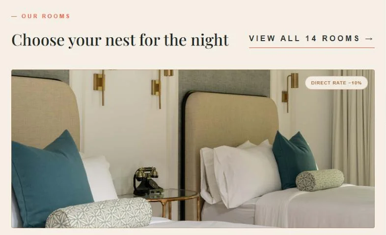 Rooms section with a suite photo and a direct rate badge